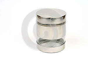 Glass jar in metal over white background