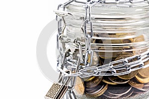 Glass jar with money and metal chain