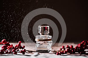 Glass jar of perfume on the table with drops