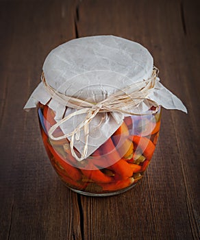 Glass jar with preserved peppers.Homemade tinned or canned food