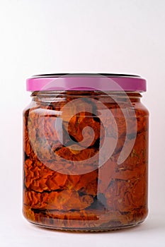 Glass jar of preserved tomatoes