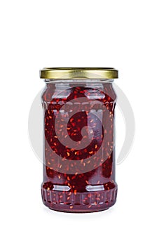 Glass jar with raspberry jam isolated on the white background