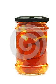 Glass jar with red little sweet peppers