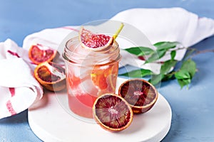 Glass Jar of Summer Juice Non-alcoholic Refreshing hHealthy Cocktail or Drink from Freshly Squeezed Red Sicilian Orange Healthy