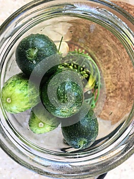 A glass jar in which cucumbers were put for canning