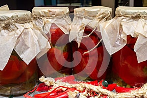 glass jars with canned red paprika