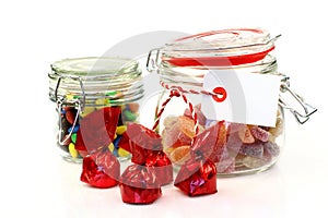 Glass jars with colorful candy and bonbons photo