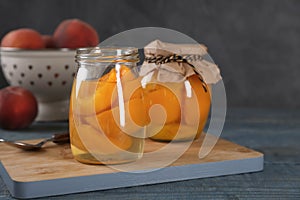 Glass jars with conserved peach halves