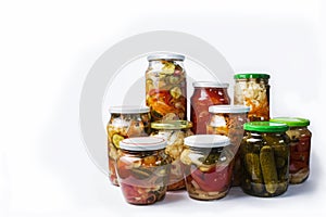 Abundance of beautiful glass jars with vegetable home-made salads isolated on white background