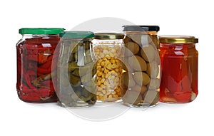Glass jars of different pickled vegetables
