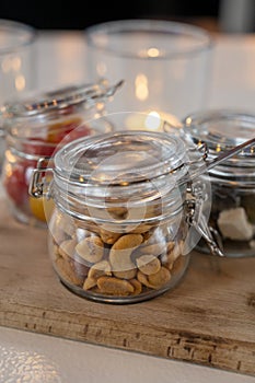 Glass jars with healthy party snacks served in bar, tasty appetisers