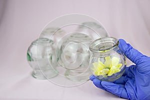 Glass jars for hijama. Yellow flowers. Bloodletting. Sunnah treatment. Islam.
