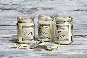 Glass jars with money.