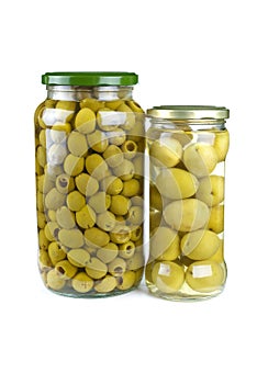 Glass jars with pitted and giant green olives