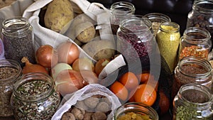 Glass jars and reusable grocery bags on the kitchen. Zero waste home. Eco Shopping. Healthy eating. Grocery storage