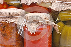 Glass jars with tinned vegetables photo