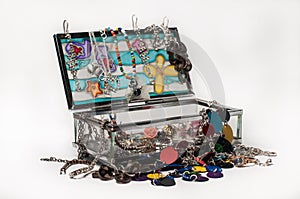 Glass jewelery box packed with accessories
