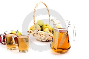 Glass and a jug of apple juice , isolated on white background