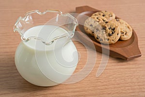 Glass jug of fresh milk and cookies
