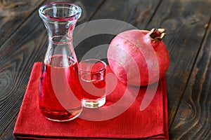 Glass jug of grenadine syrup photo