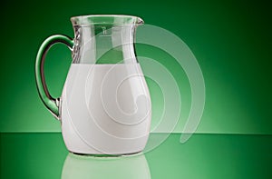 Glass jug with milk