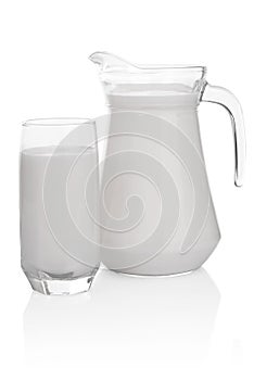 Glass and jug of milk isolated on white background