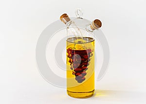 glass jug with olive oil and wine vinegar isolated on white background