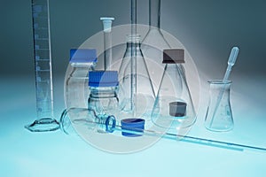 Glass laboratory apparatus on blue table