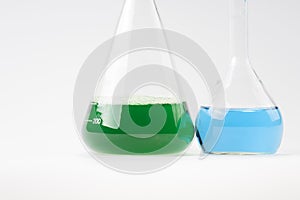 Glass laboratory apparatus with green and blue water