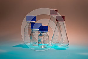 Glass laboratory apparatus isolated on blue table