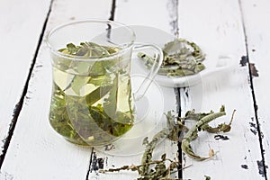 A glass of lemon balm tea