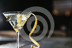 Glass of lemon drop martini cocktail in bar, closeup.