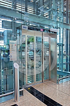 Glass lift lobby in airport building