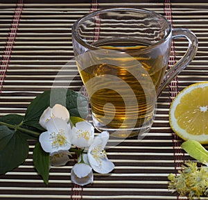 Glass of lime tea with a lemon close up