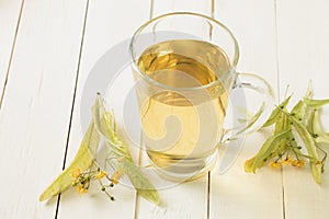 A glass of linden tea, herbal medicinal decoction