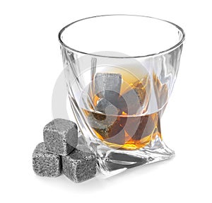 Glass with liquor and whiskey stones n white background