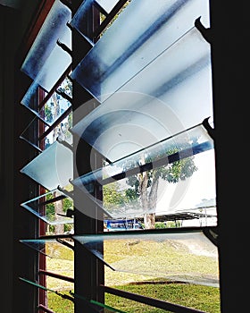 Glass louver at window