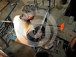 Glass making artisan in his workshop