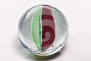 Glass marbles on white background