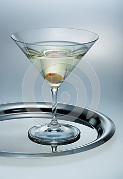 Glass of martini with olive photo