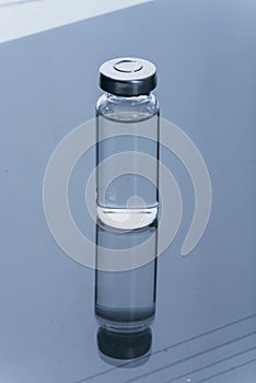 Glass medical ampoule vial for injection. Medicine is dry white drug penicillin powder or liquid with of aqueous