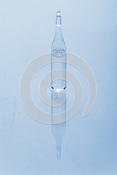 Glass medical ampoule vial for injection. Medicine is dry white drug penicillin powder or liquid with of aqueous