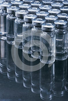 Glass medical ampoule vial for injection. Medicine is dry white drug penicillin powder or liquid with of aqueous