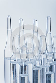 Glass medical ampoule vial for injection. Medicine is dry white drug penicillin powder or liquid with of aqueous