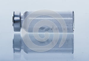 Glass medical ampoule vial for injection. Medicine is dry white drug penicillin powder or liquid with of aqueous