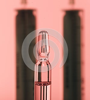 Glass medical ampoule vial for injection. Medicine is liquid sodium chloride with of aqueous solution in ampulla. Close