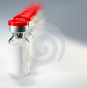 Glass medical vials of biotech drugs. photo