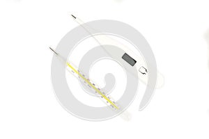 Glass mercury and digital thermometer isolated on a white background.