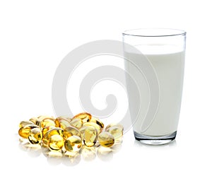 Glass of milk and fish oil isolated