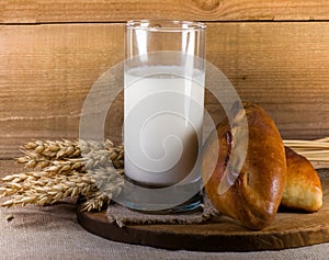 Glass with milk and fresh pies